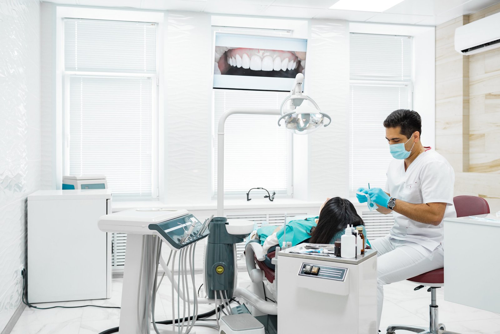 Young Girl Having Her Teeth Examined By A Dentist