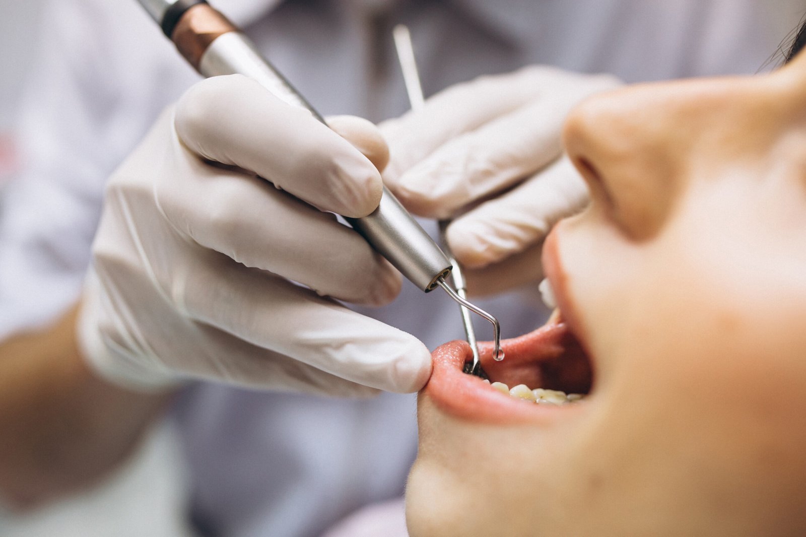 Dentist examining a patient's teeth
